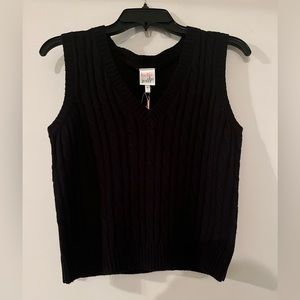 small black sweater vest from the brand “belle du jour”